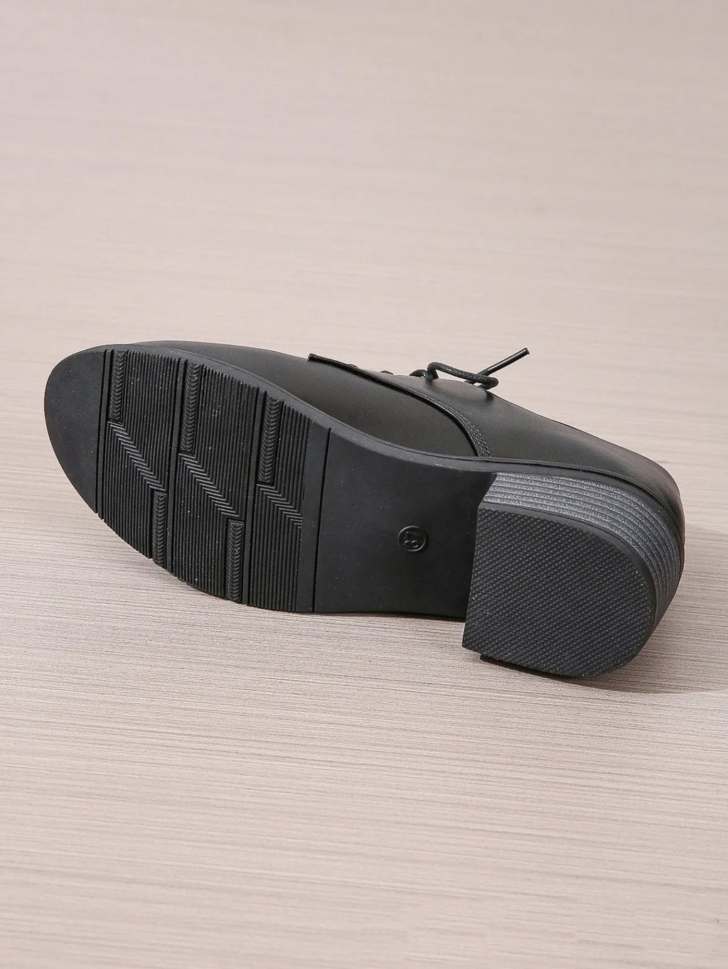 Black women's work shoes with thick rubber heel and soft sole, low top design with European styling
