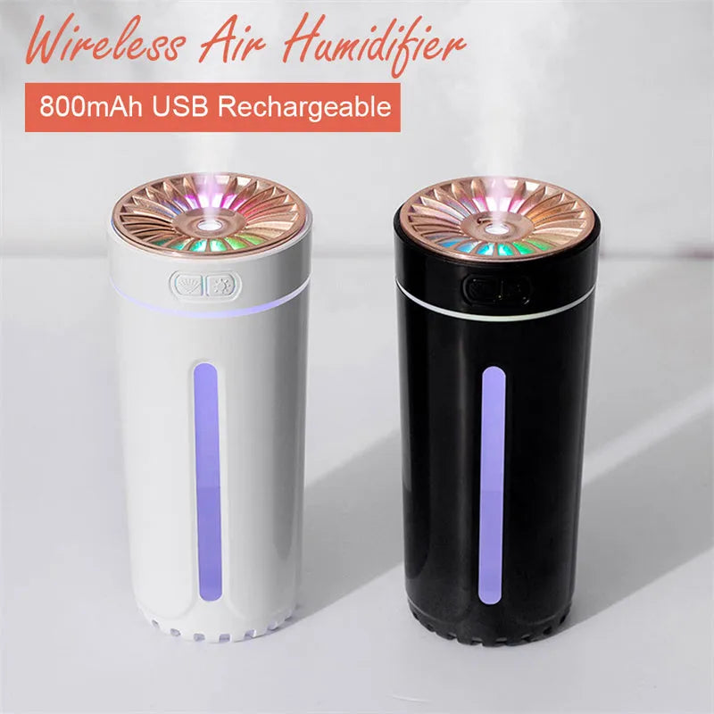 Black USB car humidifier with LED lights placed in vehicle cup holder showing mist output
