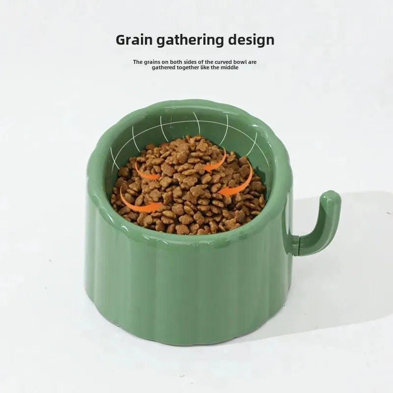Solid green cat bowl with cactus pattern and anti-slip base on a kitchen floor.
