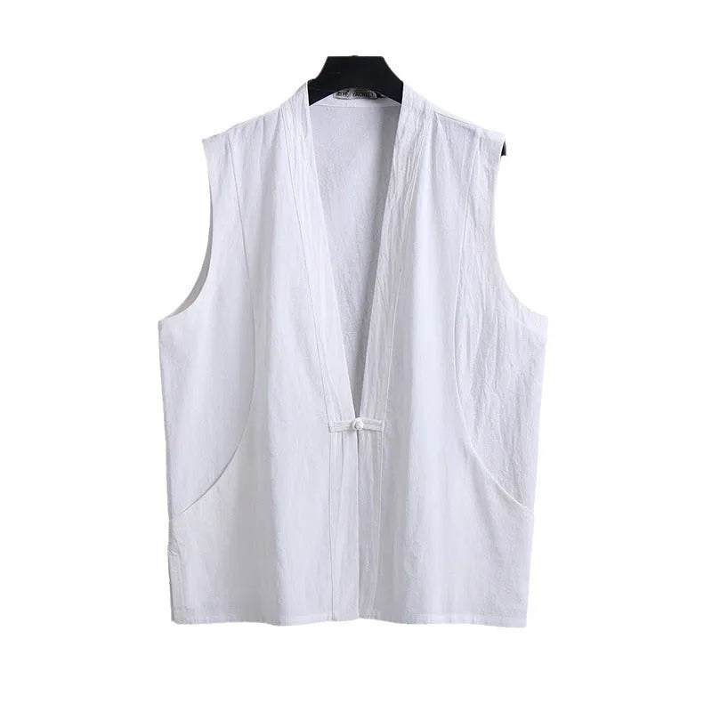 Man modelling a solid grey linen sleeveless vest with a loose fit.