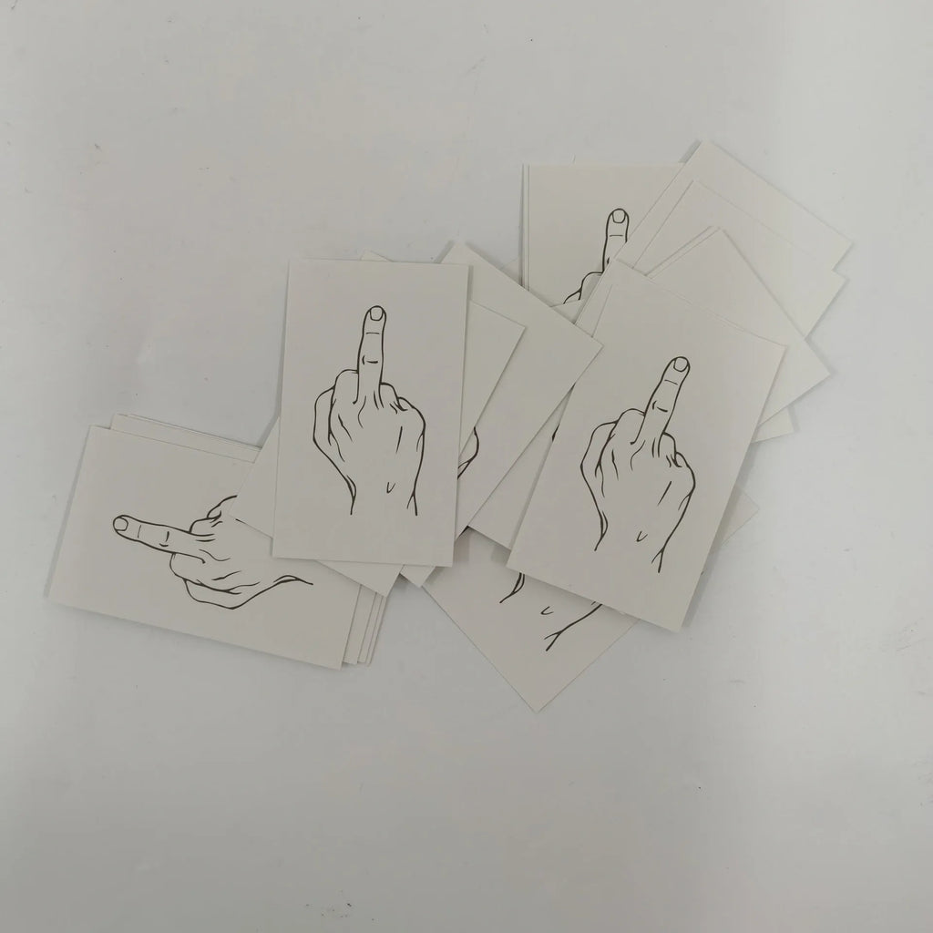 Box of paper illegal parking reminder cards featuring a printed middle finger design.