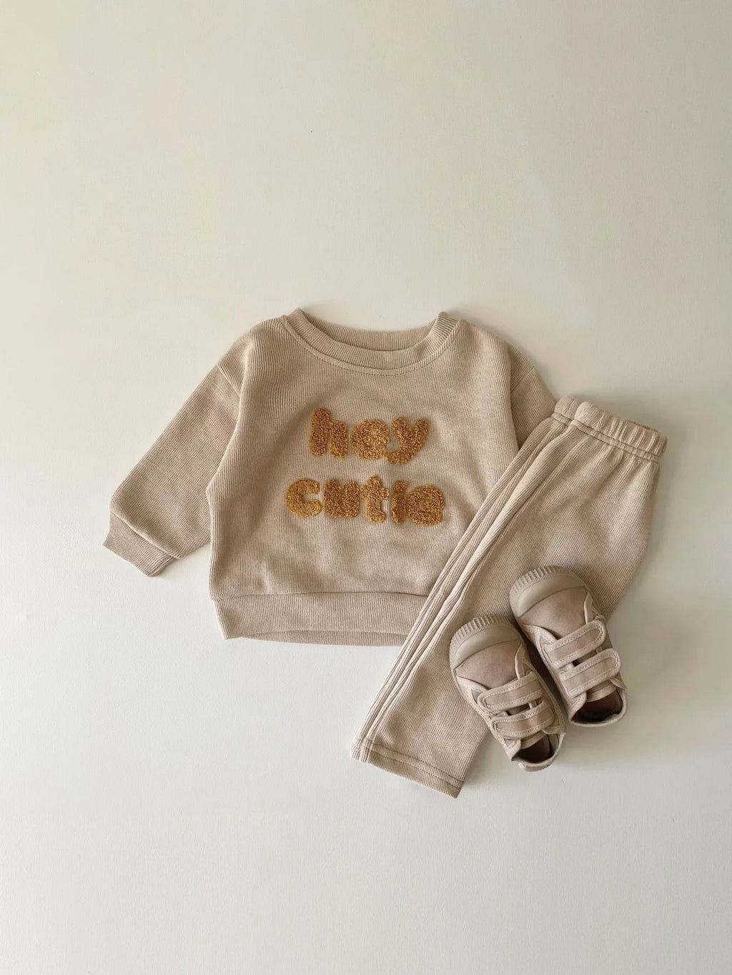 Creamy-white baby cotton two-piece suit with alphabet embroidery on long sleeve blouse and matching trousers
