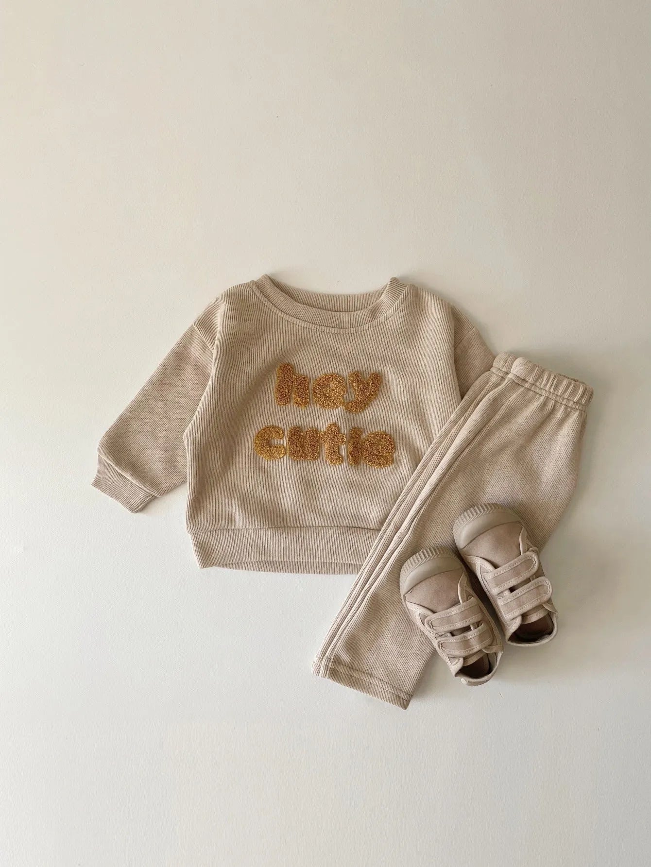 Creamy-white baby cotton two-piece suit with alphabet embroidery on long sleeve blouse and matching trousers