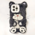 Plush pink phone case with staring cat love lens graphic on a white background