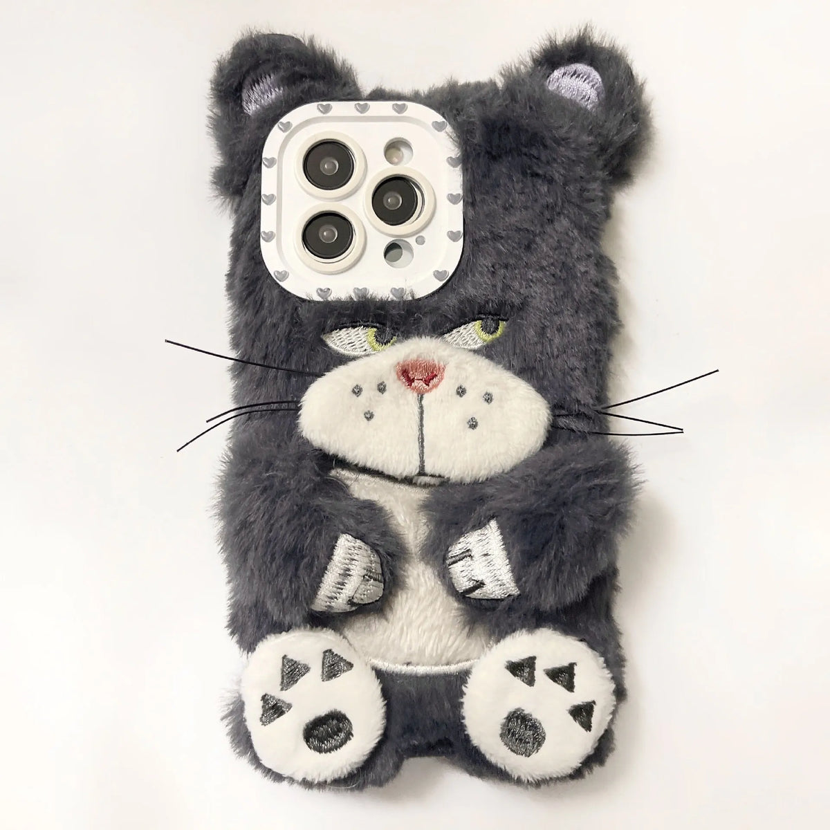 Plush pink phone case with staring cat love lens graphic on a white background