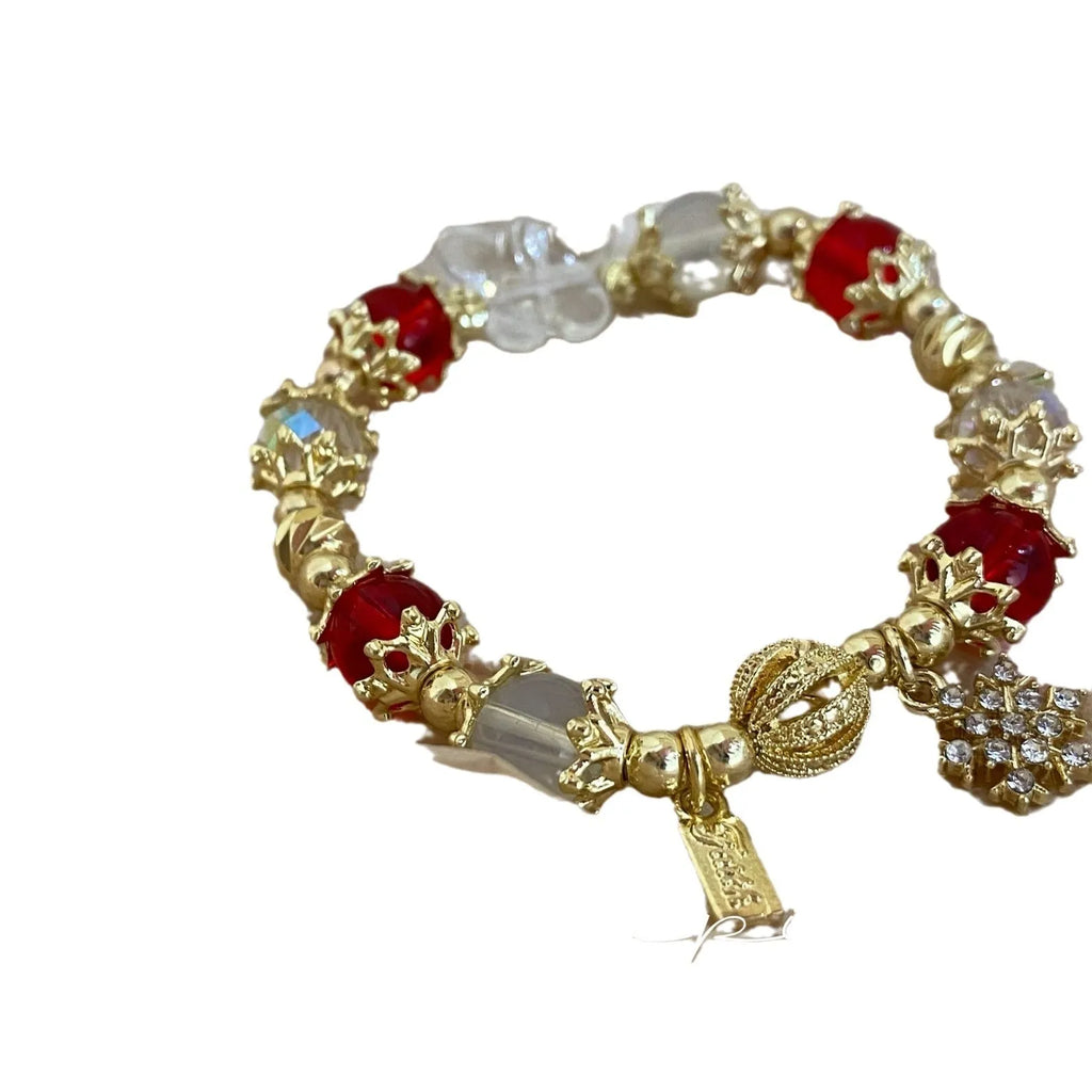 Galaxy-coloured women's bracelet with snowflake pendant, bow, and heart designs