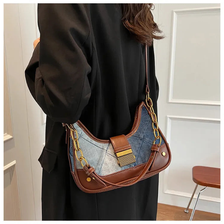 Brown soft denim women's shoulder bag with diamond mesh and chain details, showing bucket shape.