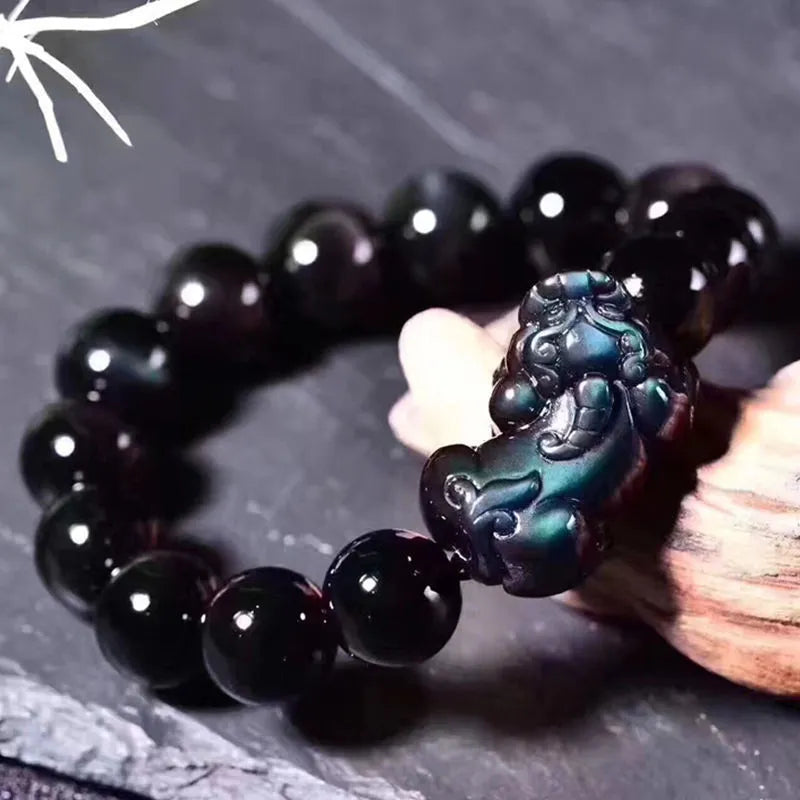 Natural ice colour obsidian crystal bracelet showing different bead size options on a wrist.
