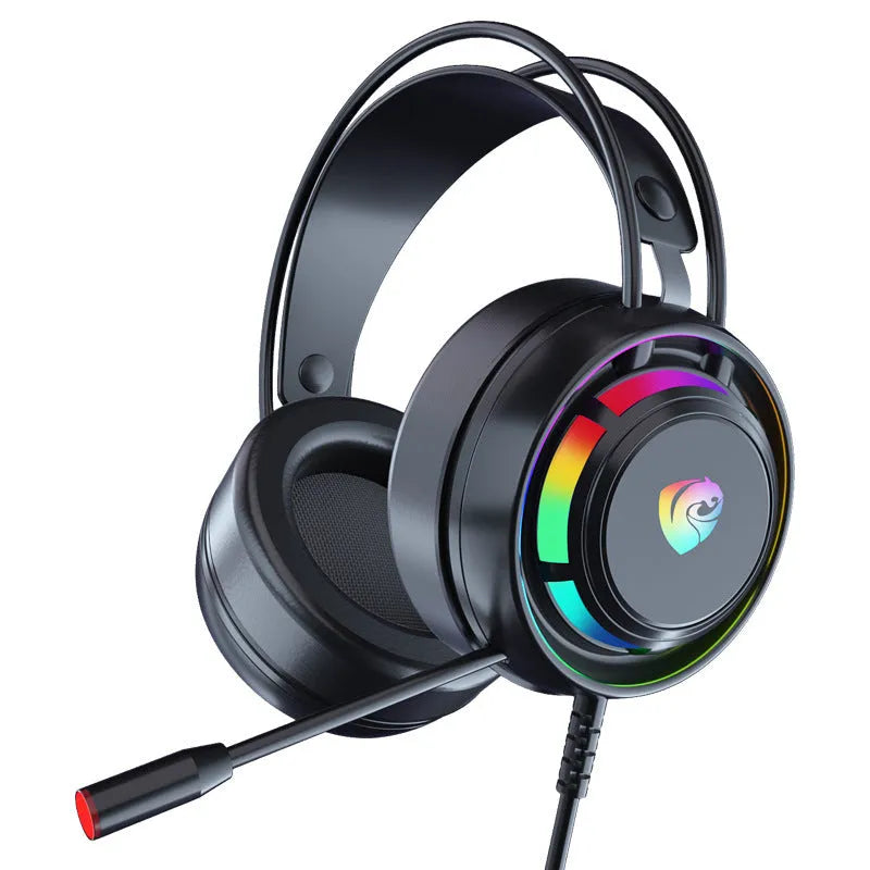 Black over-ear wired computer headset with microphone and long cable on a desk.
