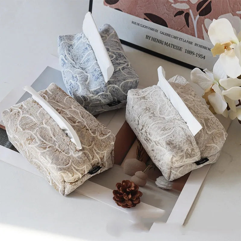 Cotton floral tissue box cover in beige, blue, and brown colour options on a table.