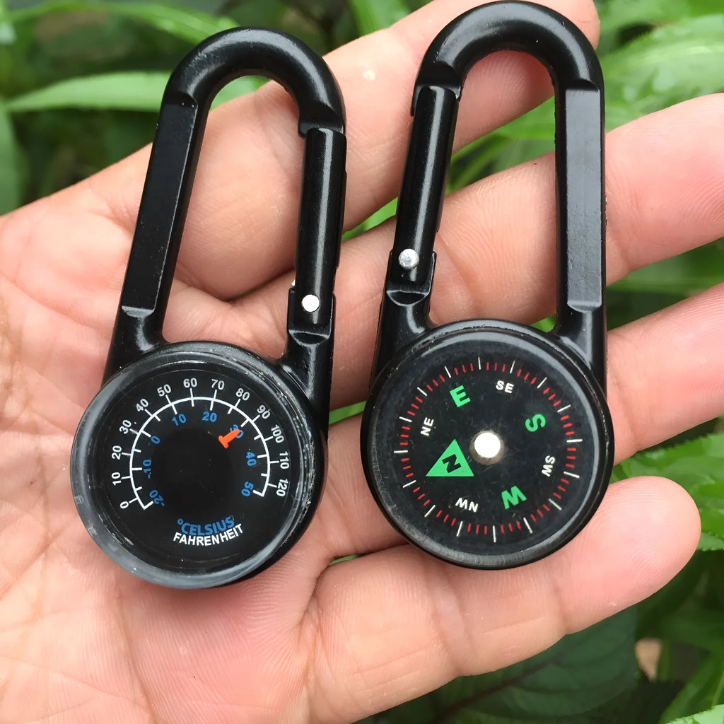 Black zinc alloy double-sided carabiner with a climbing button closure, showing integrated compass and thermometer.