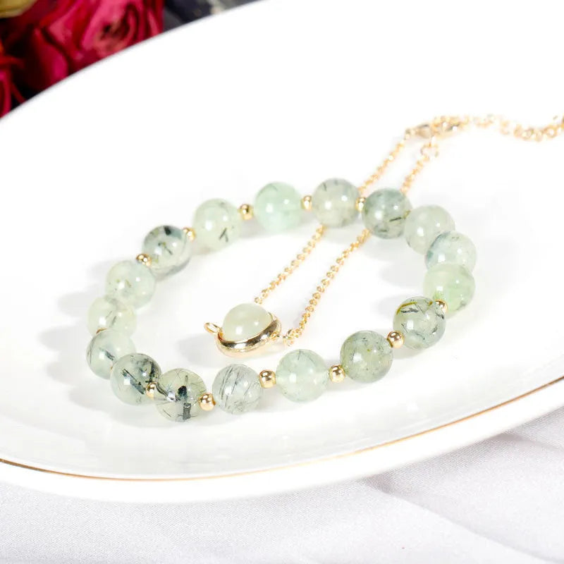 Double-layer women's bracelet with crystal beads and lucky charms in gold electroplated finish