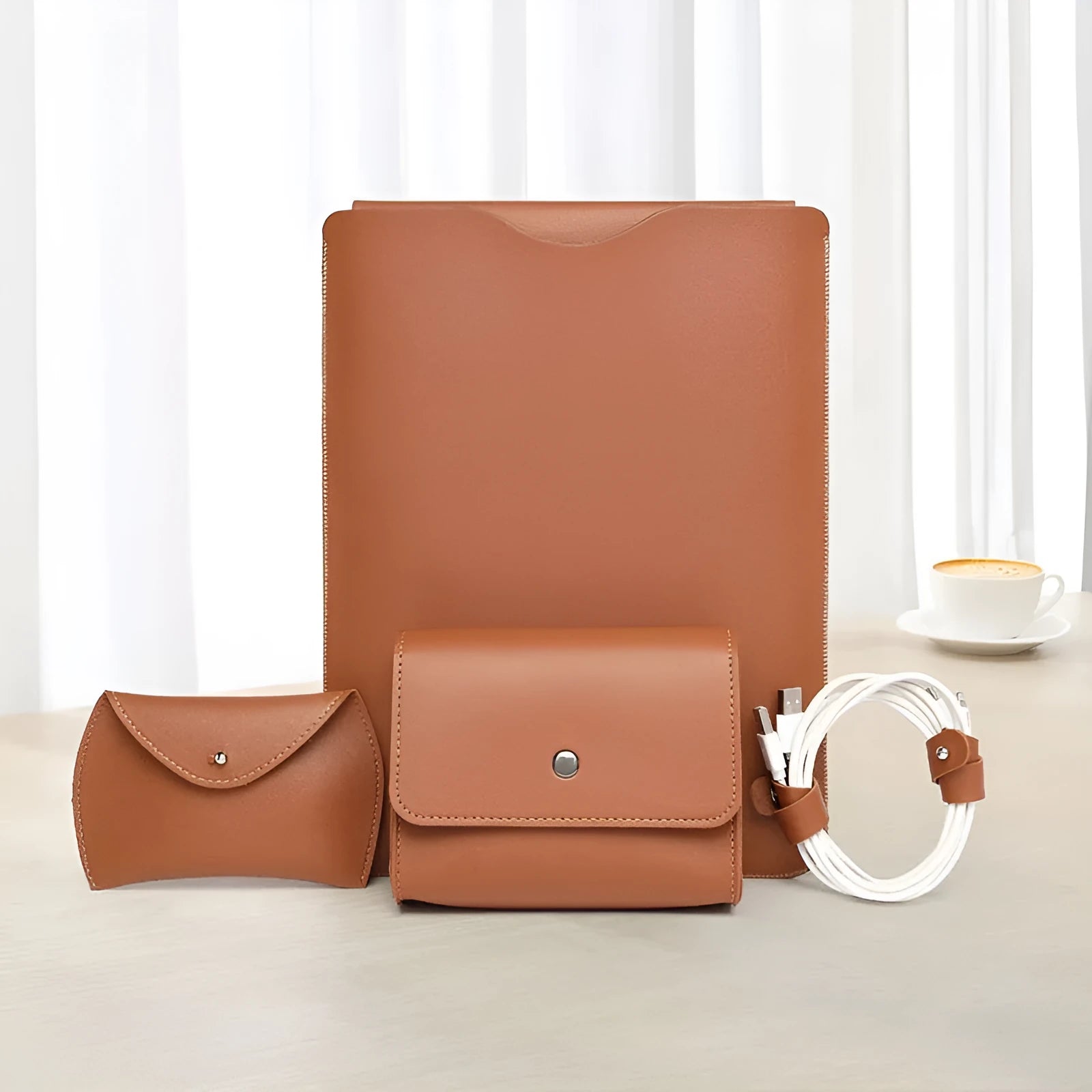 Set of four lock edge imitation leather protective covers for laptops in different colours.