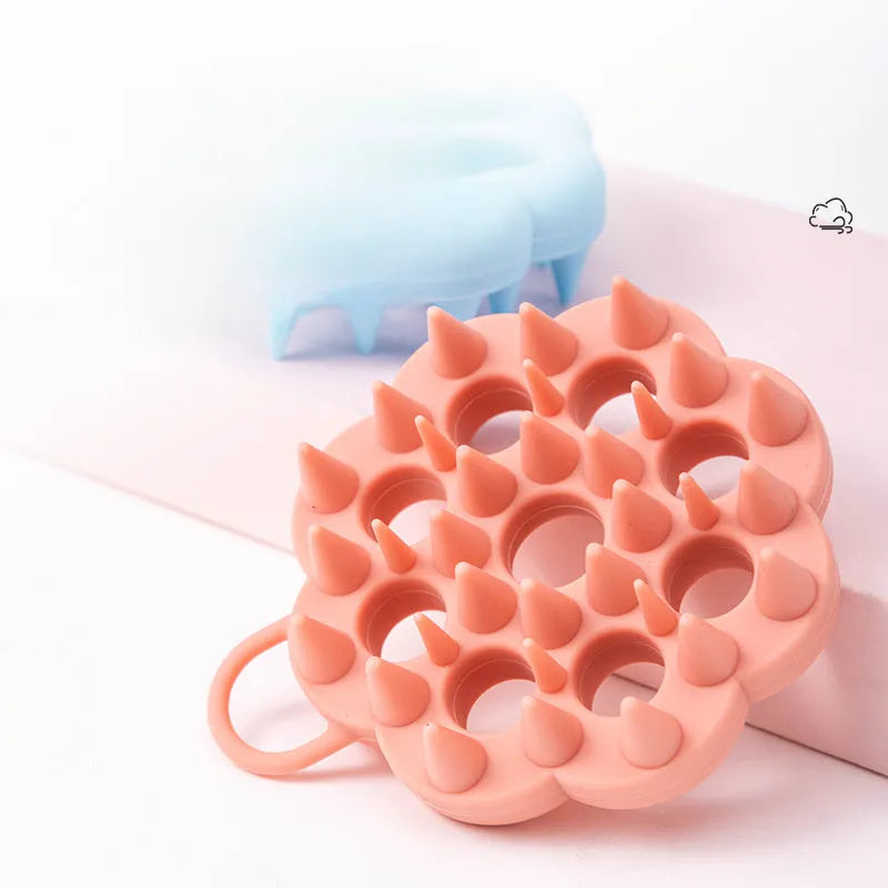 Silicone pet grooming brush with flexible pins and ergonomic handle in assorted colours
