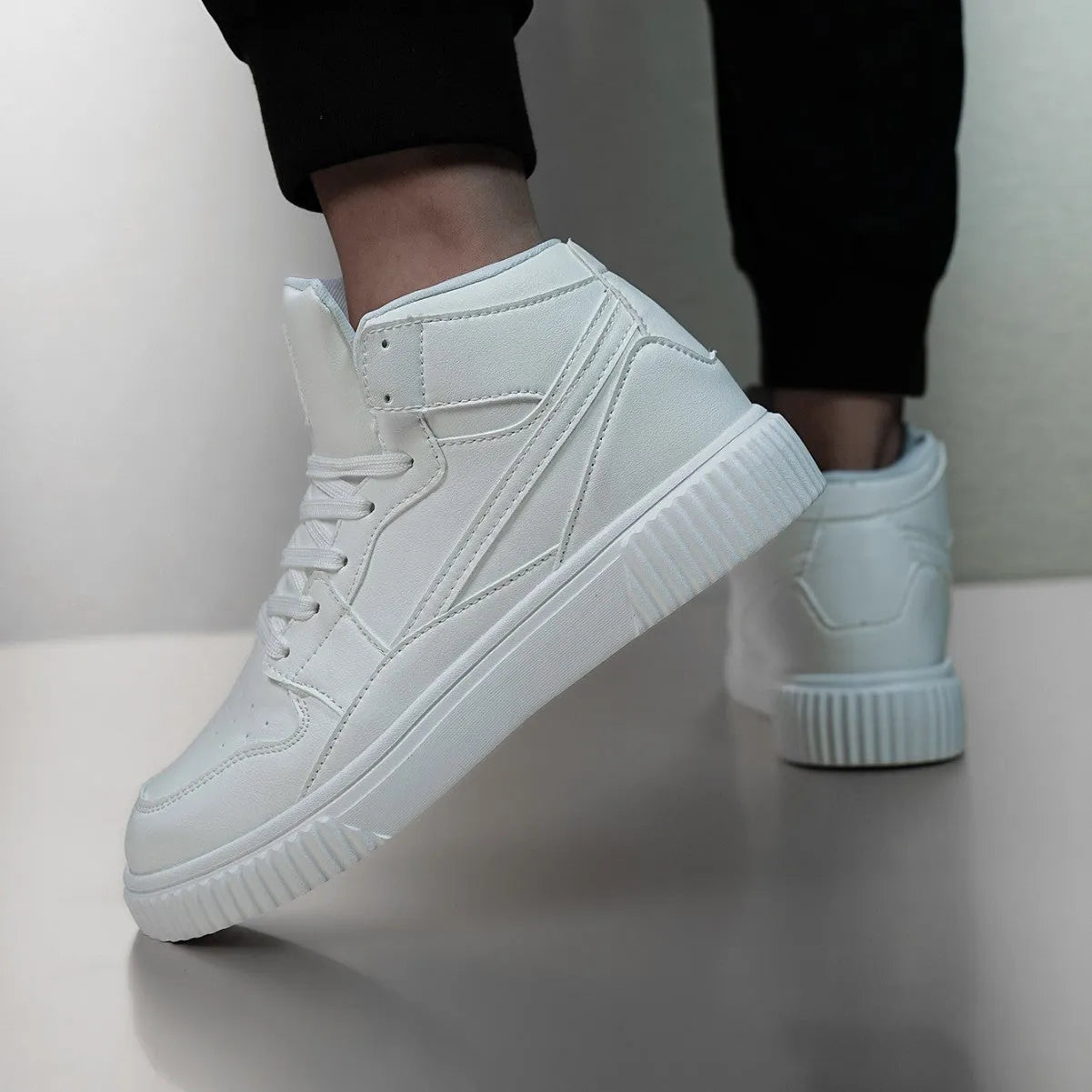 Men's solid white casual shoe with a round toe and smooth microfiber upper.