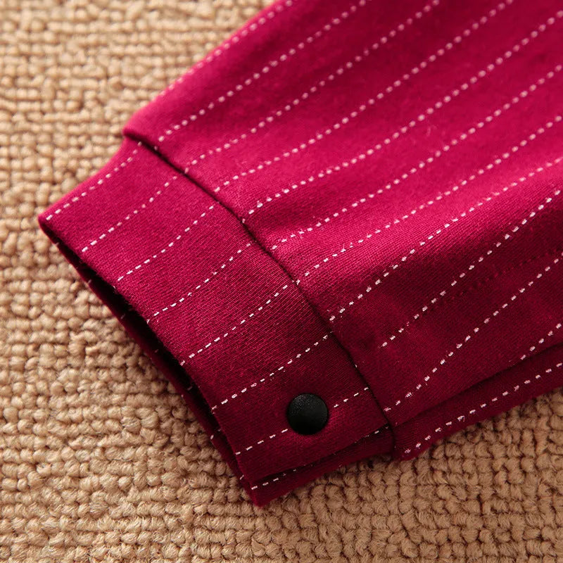 Baby boy in a wine red long-sleeve cotton gentleman jumpsuit with a single-breasted closure.