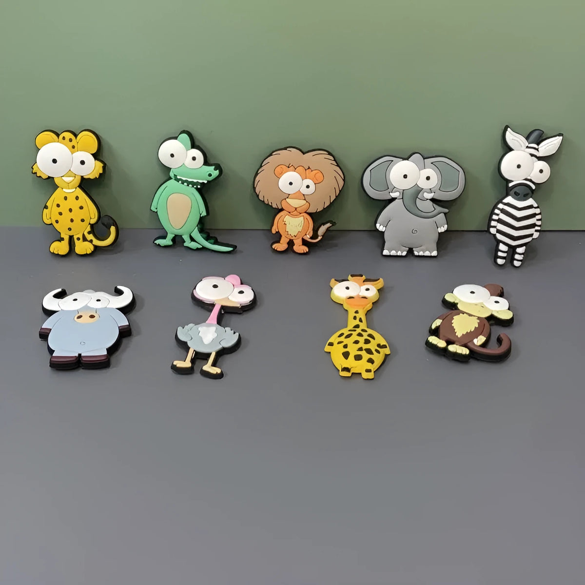 Set of nine PVC cartoon animal refrigerator stickers including monkey, crocodile, leopard, lion, and giraffe in assorted colours