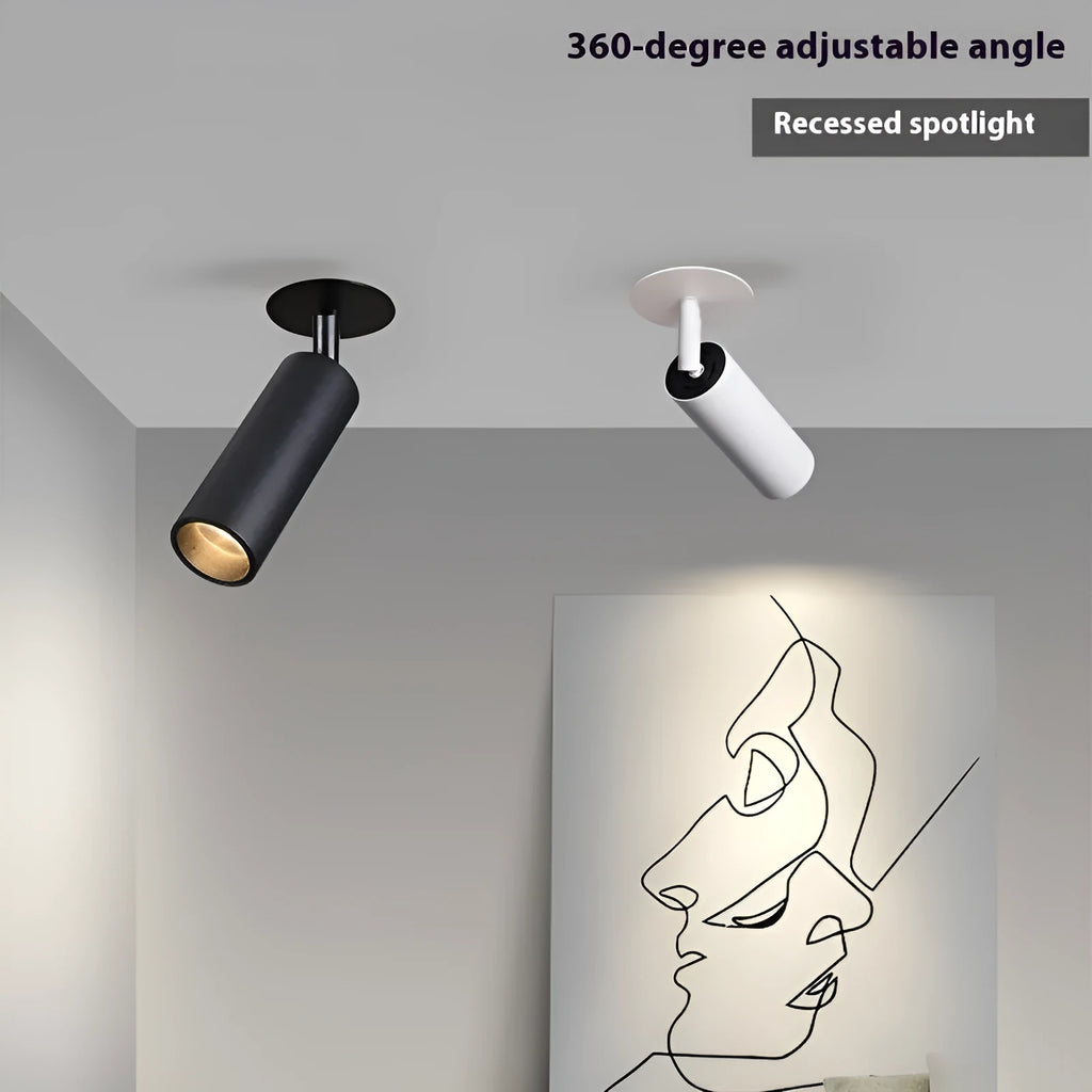 Black and white embedded cylinder LED spotlight for track lighting with selectable power and colour temperature settings.