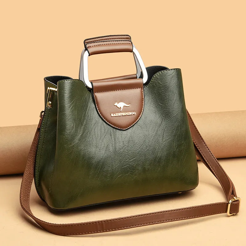 Women's barrel crossbody shoulder bag in soft PU with zip pocket and document pocket, shown in one of six colours