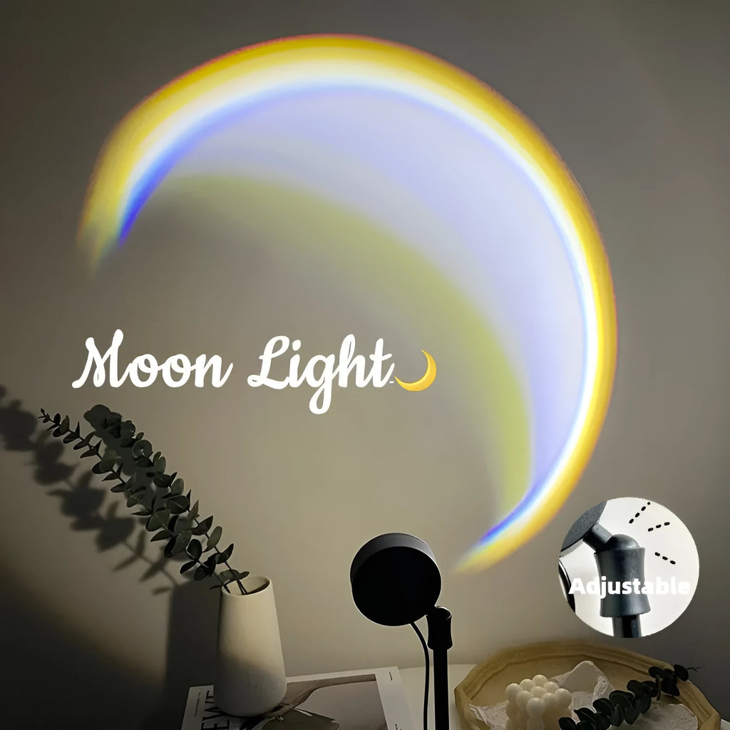 INS USB Moon Lamp LED projector on a table projecting rainbow light onto a wall.