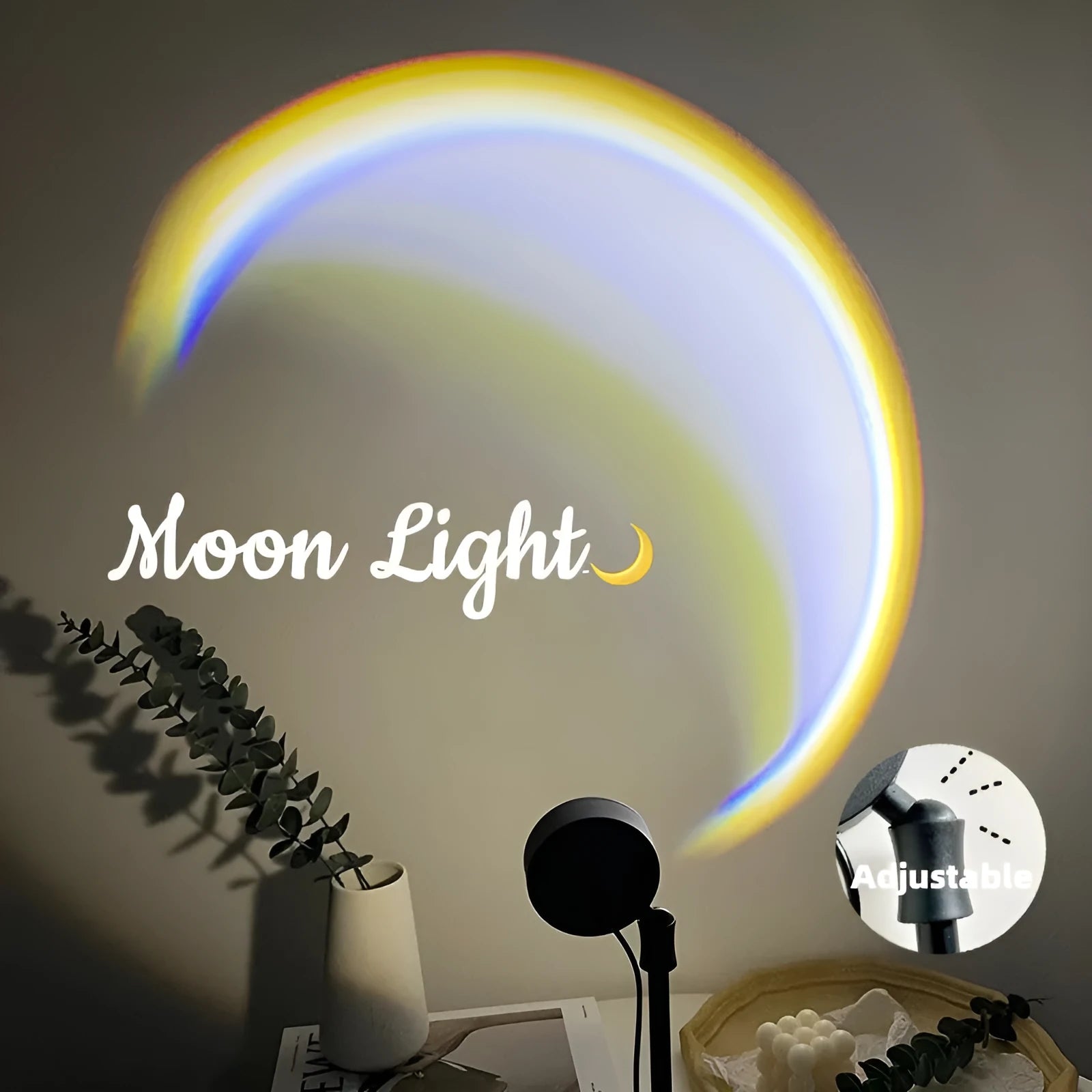 INS USB Moon Lamp LED projector on a table projecting rainbow light onto a wall.
