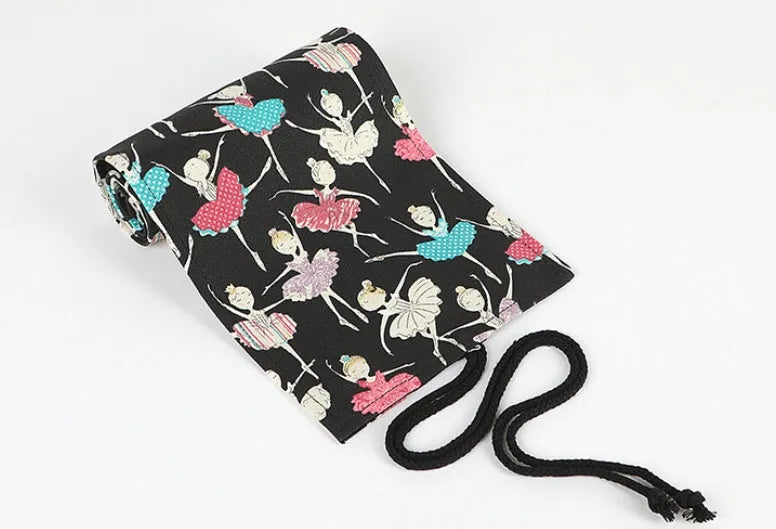 Canvas square rolling pencil case with ballet girl printing showing multiple colour pencils organised in slots