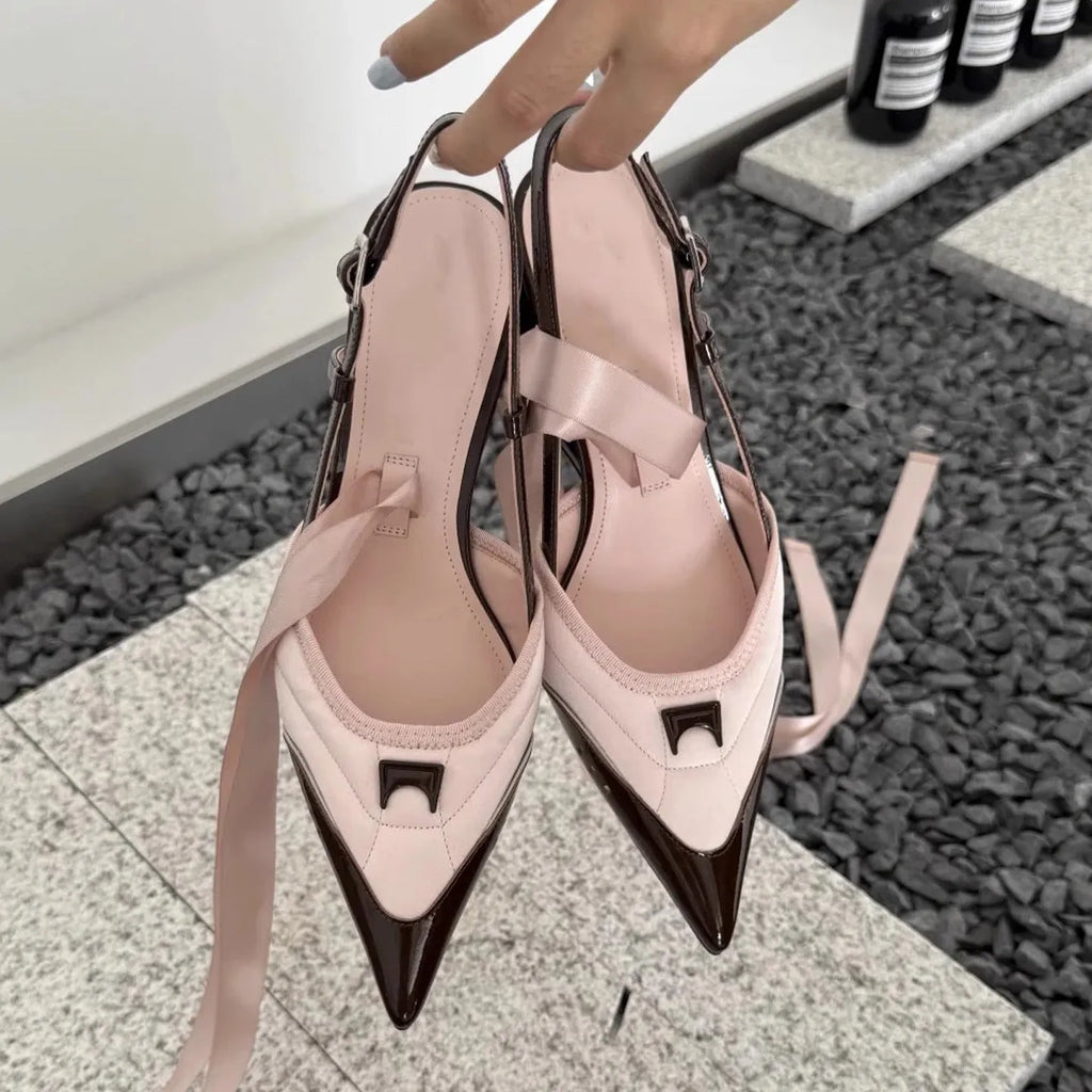 Women's black lace-up high heels with a special-shaped root design on a white background.