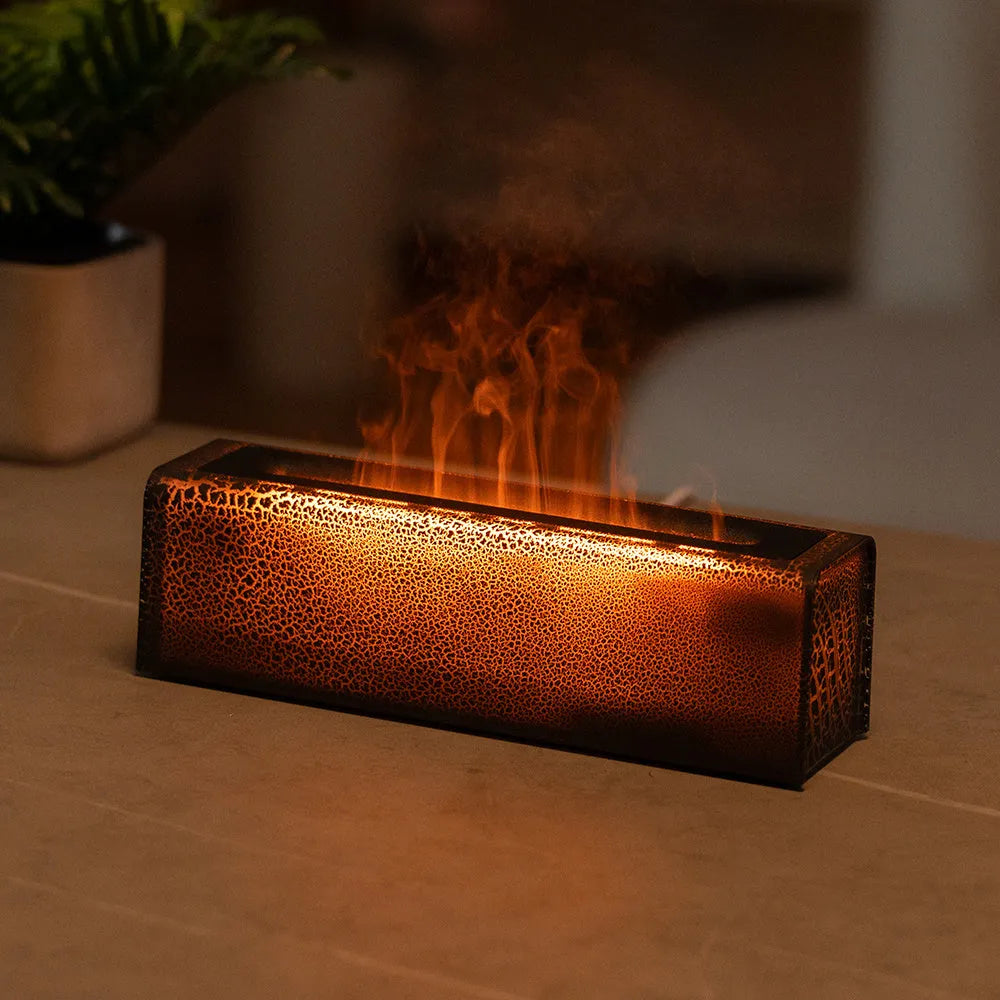 USB lava flame humidifier in black or white with colourful simulated flame and aromatherapy function on a desktop