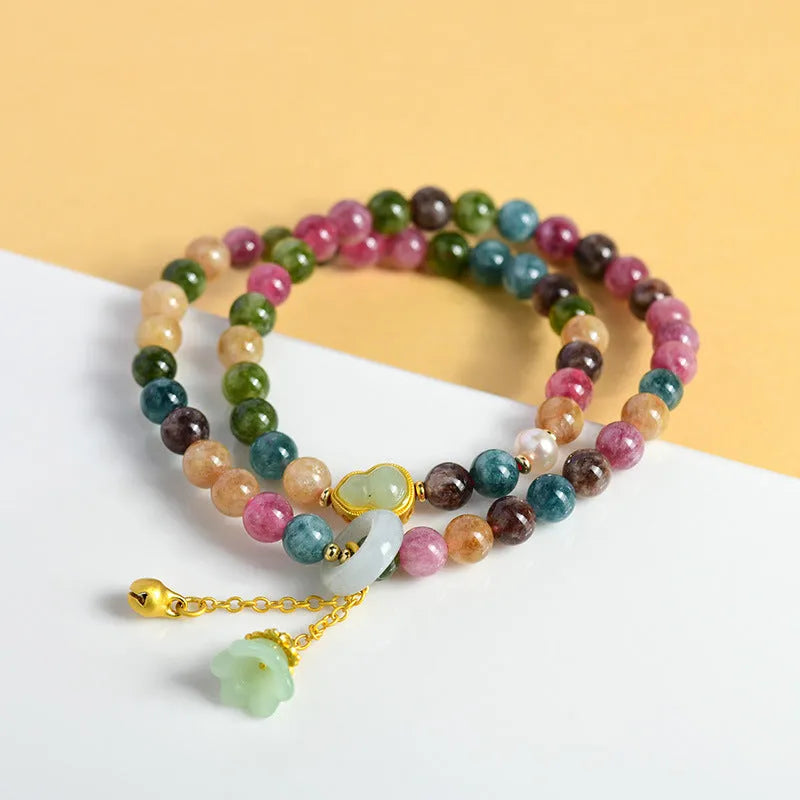 Close-up of a women's double ring bracelet made from round natural chalcedony crystal beads.