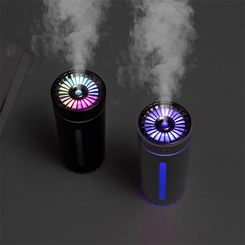 Black USB car humidifier with LED lights placed in vehicle cup holder showing mist output