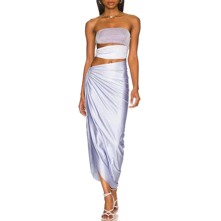 Purple one-piece swimsuit with a matching wrap skirt on a mannequin.