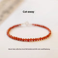 Women's retro-style bracelet with natural southern red agate stones in red colours on a white background.