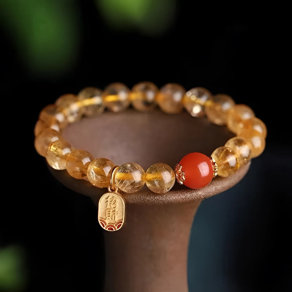 Polished natural red agate beaded bracelet showing stone texture and bead proportion