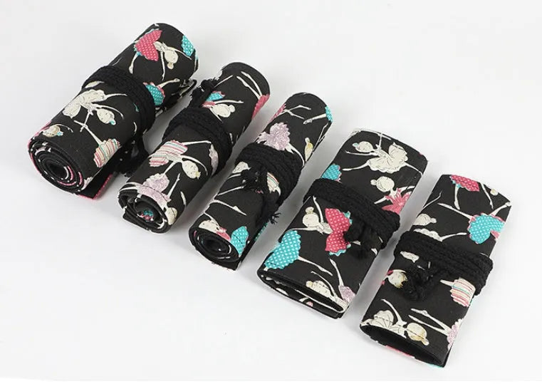 Canvas square rolling pencil case with ballet girl printing showing multiple colour pencils organised in slots