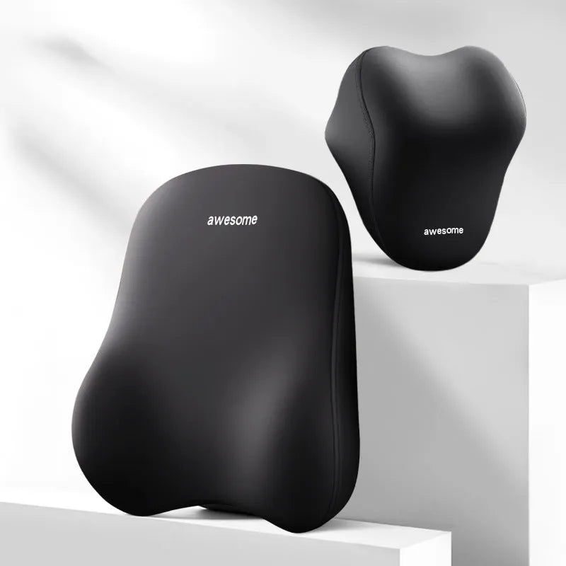 Black and beige memory foam car headrest pillow and lumbar support cushion on a vehicle seat.