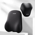 Black and beige memory foam car headrest pillow and lumbar support cushion on a vehicle seat.
