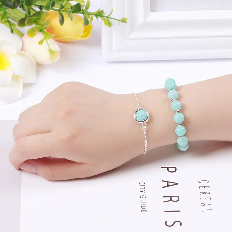 Double-layer women's bracelet with crystal beads and lucky charms in gold electroplated finish