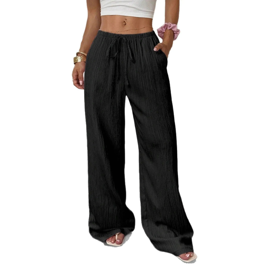 Women's black wide-leg trousers with a front lace-up detail on the mid-rise waistband.