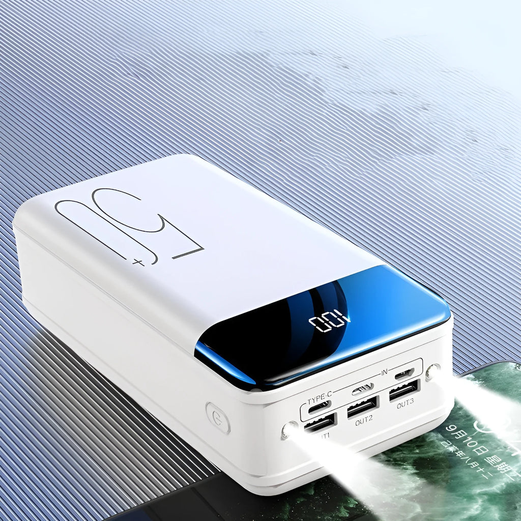 Black large capacity 50000mAh portable power bank with three USB output ports showing size scale.
