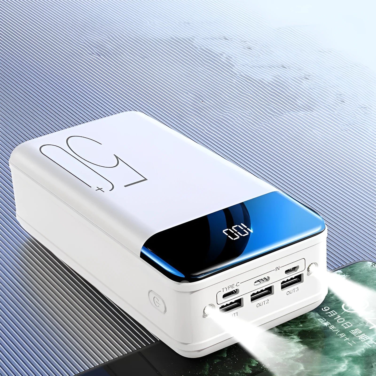 Black large capacity 50000mAh portable power bank with three USB output ports showing size scale.