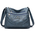 Soft leather crossbody shoulder bag in horizontal square design with zippered internal pocket