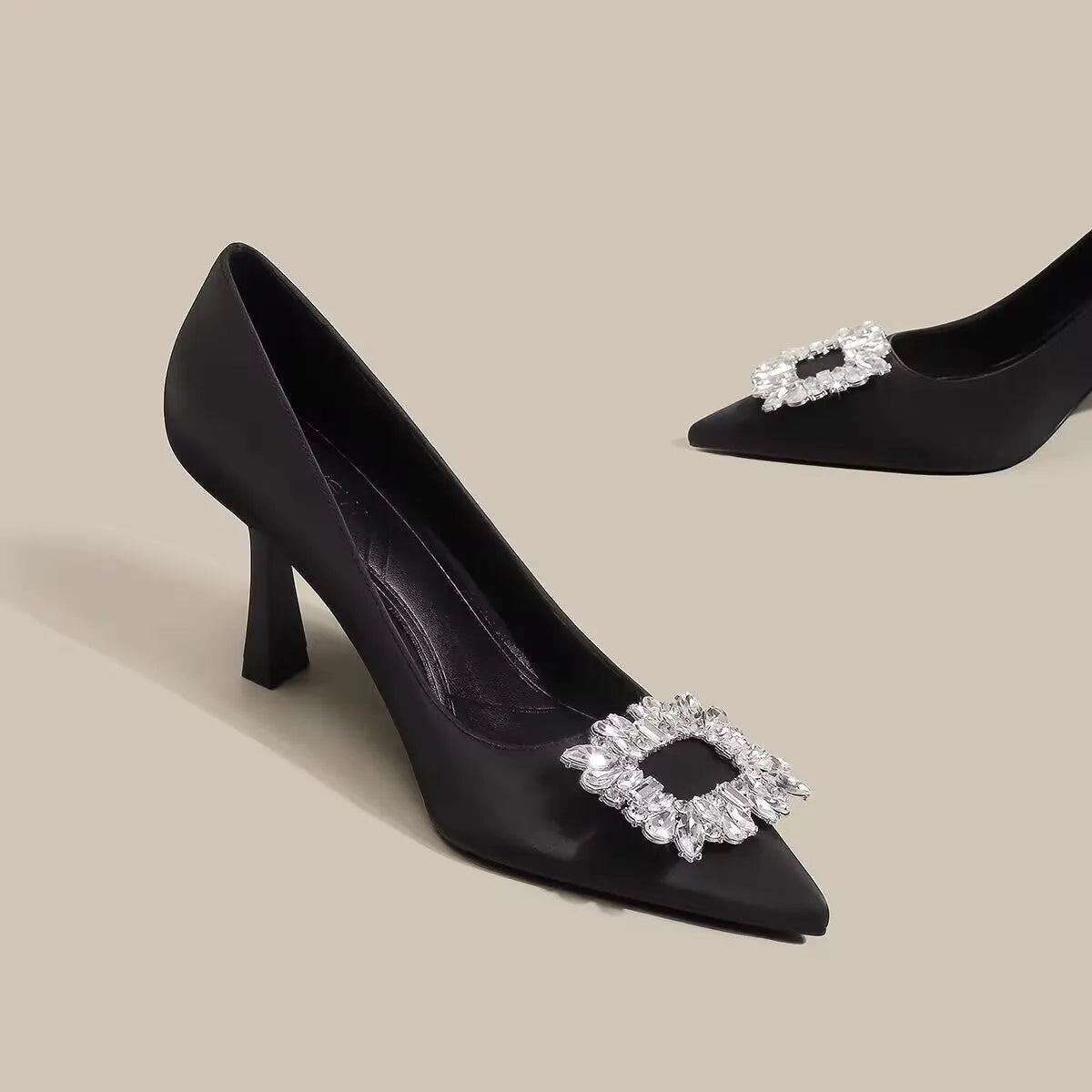 Women's creamy-white pointed toe stiletto high heel pumps for formal wear.