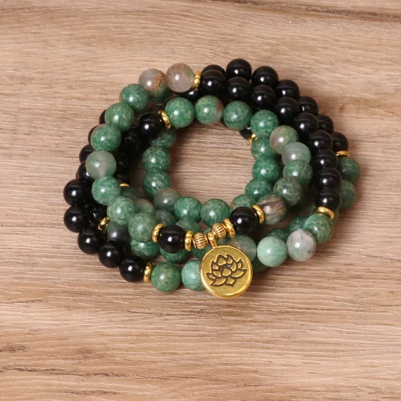 Green and black elastic beaded long bracelet with alloy construction