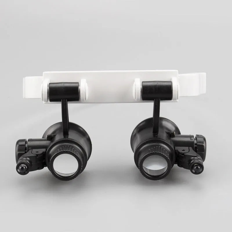 White head-mounted magnifying glass with LED light, shown folded and unfolded for watch repair work.