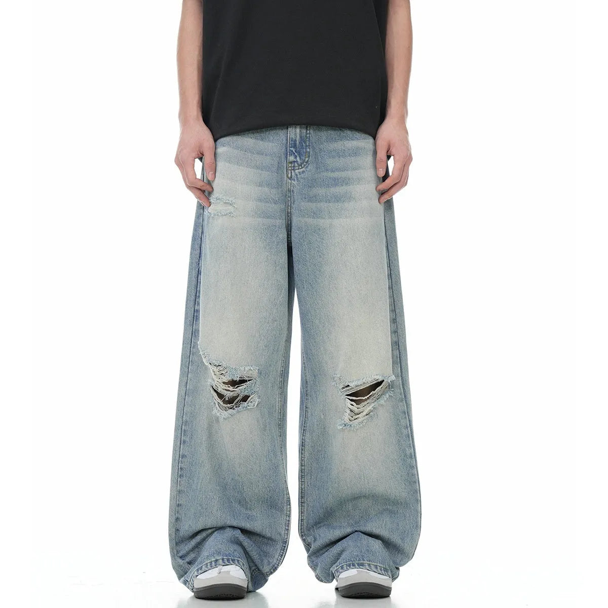 Men's blue straight-leg ripped jeans on a white background showing retro detailing and zip fly
