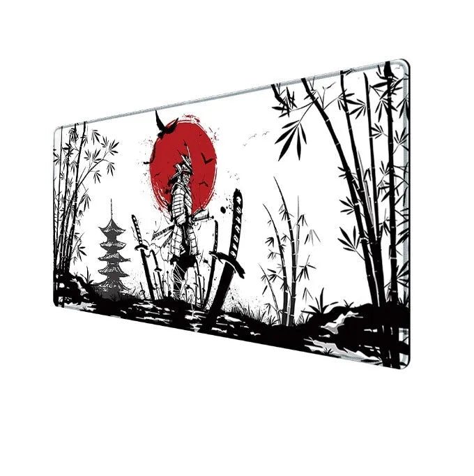 Japanese samurai design cloth gaming mouse pad on a desk with a gaming mouse.