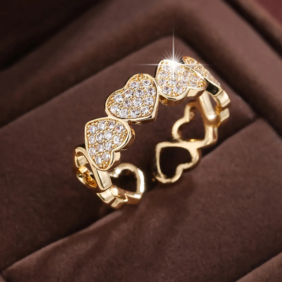 Adjustable gold and silver couples ring with love heart design on a geometry band.