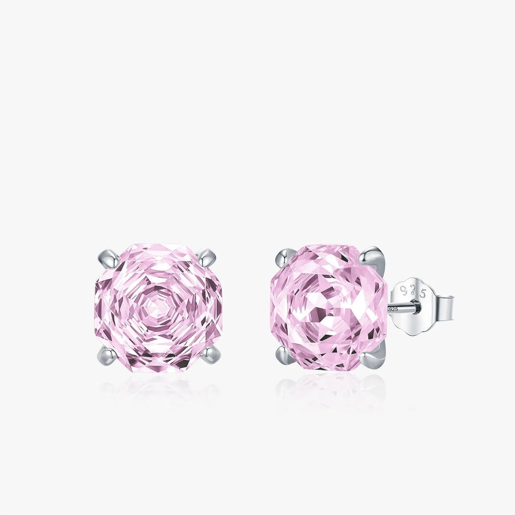 Close-up of S925 sterling silver rose stud earrings for women on a pink background.