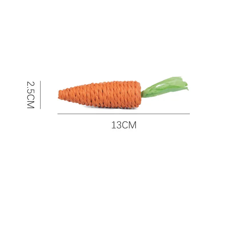 Cat toy set with carrot-shaped paper bites, ringing stones, and grinding sticks on soft surface