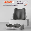 A grey and blue memory foam seat cushion for waist and tailbone support on an office chair.